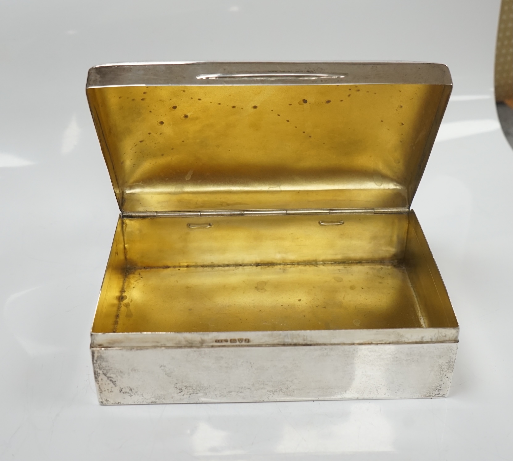 Two silver cigarette boxes, the largest by Stokes & Ireland, Chester, 1906, 14.7cm. Condition - poor to fair